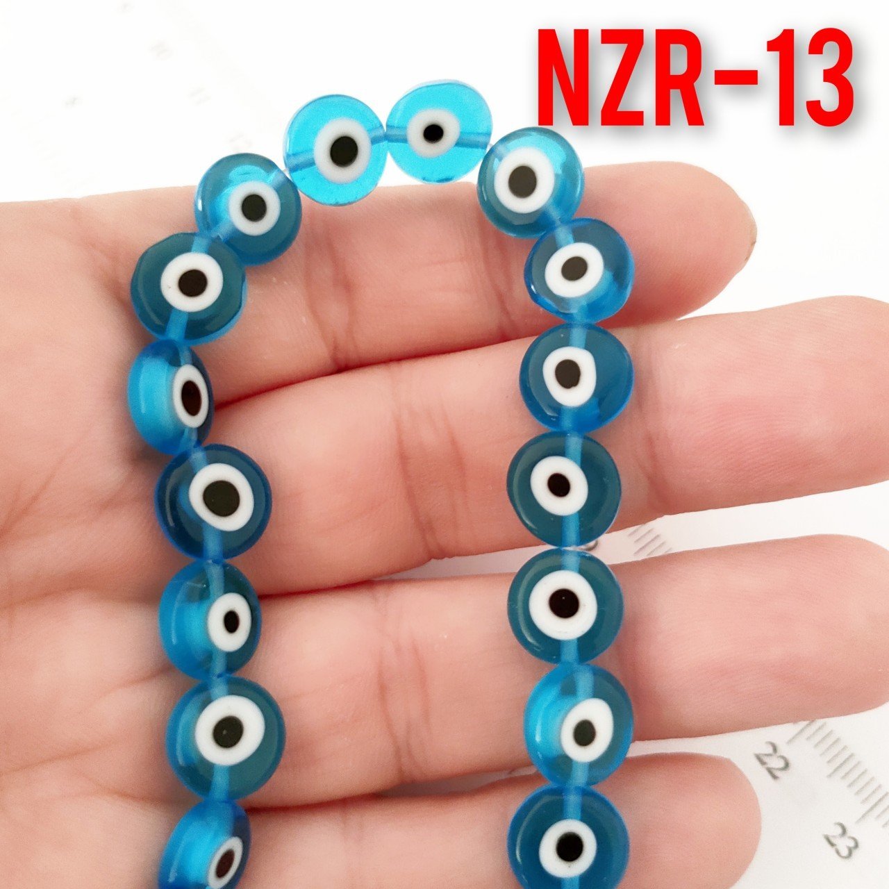 NZR-13  Açık Mavi Yassı Dizi Nazar Boncuğu 10*4 mm